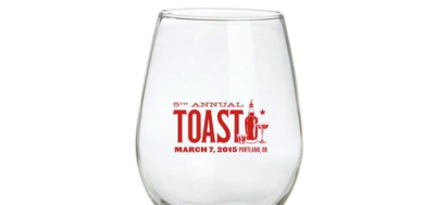 Glass branded with the Toast logo